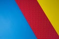 Abstract geometric blue, yellow and red polka dot paper background. Royalty Free Stock Photo