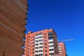 Abstract geometric construction template with new high-rise buildings and tower crane isolated on blue sky background. Urban Royalty Free Stock Photo