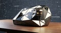 Abstract geometric form representing artificial intelligence and data processing on a table Royalty Free Stock Photo