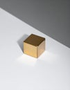 Abstract Geometric Gold Cube with Stark Shadow Royalty Free Stock Photo