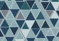 An abstract geometric pattern comprising numerous triangles in varying shades of blue and gray. The Royalty Free Stock Photo