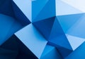 Abstract geometric pattern featuring an array of blue polygons with sharp edges and varying shades. Royalty Free Stock Photo