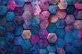 Abstract geometric pattern with vibrant hexagonal tiles in shades of blue, pink, and purple, creating a textured mosaic
