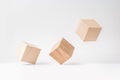 Abstract geometric real wooden cube with surreal layout on white floor background, the symbol of leadership, teamwork and growth