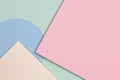 Abstract geometric texture background of fashion soft green, pastel pink, light blue, yellow color paper. Top view. Royalty Free Stock Photo