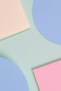 Abstract geometric texture background of soft green, pastel pink, light blue, yellow color paper. Top view, flat lay Royalty Free Stock Photo