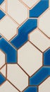 Abstract geometric tile design featuring white and vibrant blue shapes interconnected by copper Royalty Free Stock Photo