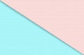 Abstract geometric water color paper background in soft pastel pink and blue trend colors with diagonal line.