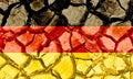 Grunge Germany flag isolated on dry cracked ground background