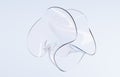 Abstract glass figure twisted round shape. Holographic clear sculpture in curve wavy smooth forms, acrylic or plastic Royalty Free Stock Photo