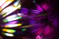 Vivid purple and pink background with rainbow colored out of focus light reflections