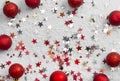 Abstract glittered Christmas background with red baubles over white board. Copy space Royalty Free Stock Photo