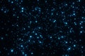 Abstract Glittering shining blue Particles on black background 3D rendering