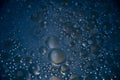 Abstract glitter dark blue bubbles bokeh background Royalty Free Stock Photo