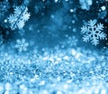 Abstract glowing Christmas blue background with snowflakes