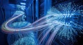 Abstract glowing fiber optics in a dark server room representing data transfer and technology Royalty Free Stock Photo