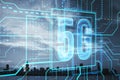 Abstract glowing linear 5g hologram on blurry city background. 5G network and wireless systems. Royalty Free Stock Photo