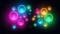 Abstract glowing neon bubbles with vibrant colors on a dark background Royalty Free Stock Photo