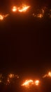 Abstract glowing orange particles forming a circular frame in darkness, symbolizing fire energy and creative motion Royalty Free Stock Photo