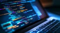 Abstract glowing programmer workspace with open laptop and colorful source code editor display. Royalty Free Stock Photo