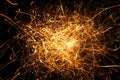 Abstract glowing sparks texture, dynamic golden light particles on a dark background, bold and