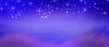 Abstract Shiny Sparkles and Snow Falling in Blurred Purple and Blue Background Royalty Free Stock Photo