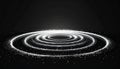 Abstract glowing white light circles on dark background with sparkling particles Royalty Free Stock Photo
