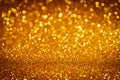 Abstract gold Christmas glowing background with shiny defocused lights, bokeh Royalty Free Stock Photo