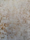 Abstract gold color painted on grunge rough surface of stucco concrete wall. Golden texture background and wallpaper Royalty Free Stock Photo