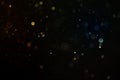 Abstract gold glitter explosion on bokeh black background Royalty Free Stock Photo