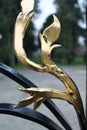 Abstract gold leaf on wrought iron gate