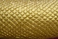 Abstract gold yellow serpent scale statue texture Royalty Free Stock Photo