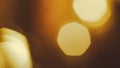 Abstract golden bokeh lights with hexagonal shapes and soft focus background Royalty Free Stock Photo