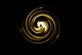 Abstract golden circle with light spiral on black background