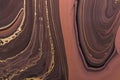 Abstract Golden curl on brown waves. Art Deco marbling background or texture. Acrylic Fluid Art