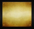 Golden metal plate with rivets on a black background. Metal texture for design.3d illustration. Royalty Free Stock Photo