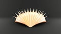 Abstract golden shell sculpture with spiky texture on black background Royalty Free Stock Photo