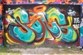 Abstract graffiti by an unidentified artist on wall.