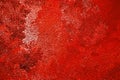 Abstract grainy background in deep red. Surface of ice crystals close-up. Tinted vivid backdrop or wallpaper. Chaotic spots and Royalty Free Stock Photo