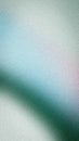 Abstract grainy background featuring a soft gradient of emerald green, light blue, and silver grey. Elegant vertical texture for Royalty Free Stock Photo