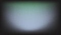 Abstract grainy background with central soft light emanating from subtle blue and grey gradient Royalty Free Stock Photo