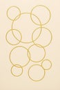 Gold circles Pattern on a Cream Background Royalty Free Stock Photo