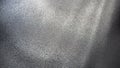 Abstract gray background with gradient, coarse grain. Selective focus. Blurred backdrop with dots and glow. Royalty Free Stock Photo