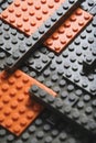 Abstract gray orange background from lego children designer