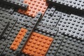 Abstract gray orange background from lego children designer