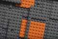 Abstract gray orange background from lego children designer.