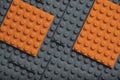 Abstract gray orange background from lego children designer.