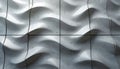 Abstract gray and white wavy pattern covers square tiles. Smooth surfaces create flowing shapes with soft shadows. Geometric Royalty Free Stock Photo