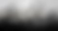 Abstract grayscale gradient background with blurred pixelated texture Royalty Free Stock Photo