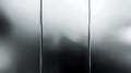 Abstract grayscale texture featuring blurred lines and a subtle, textured glass effect ideal for design backgrounds Royalty Free Stock Photo